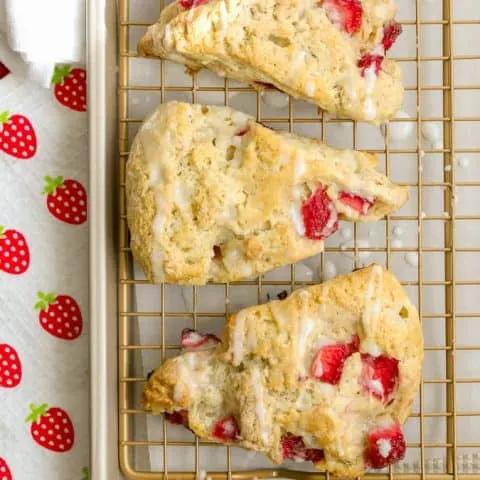 Homemade strawberry scones with powdered sugar glaze