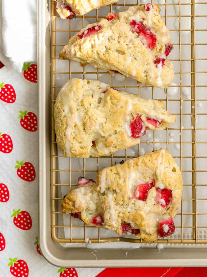 Homemade strawberry scones with powdered sugar glaze