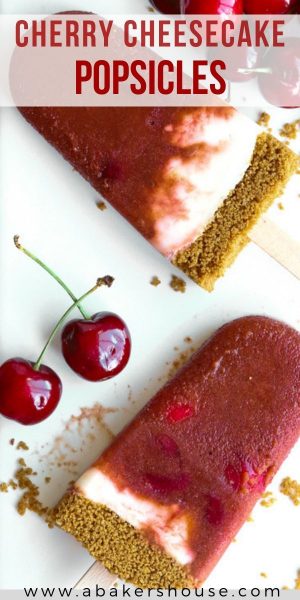 Pinterest image of two cherry cheesecake popsicles with cherries on a white plate