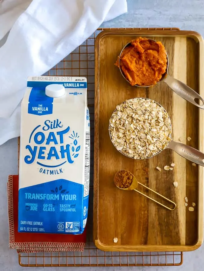 Ingredients for smoothie bowl of puree pumpkin, oats, and oatmilk