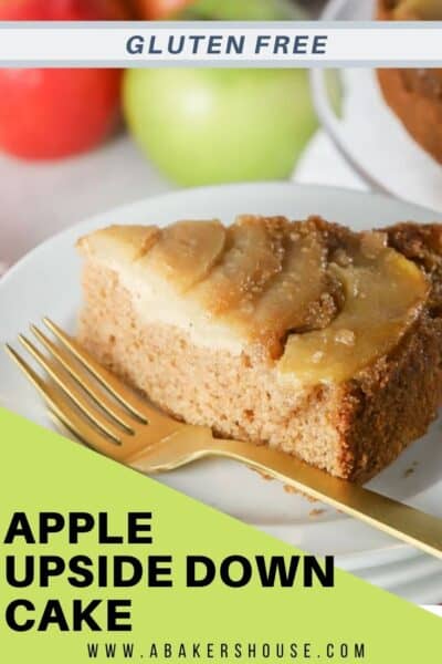 Slice of caramel apple spice cake upside down cake on white plate with golf fork