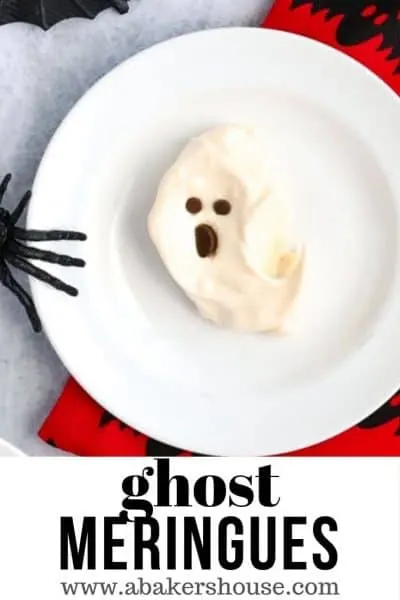 Pinterest image of one ghost meringue cookie on white plate
