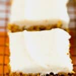 Pinterest image of close up pumpkin square with cream cheese frosting