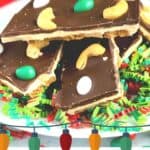Pinterest image of a stack of cashew chocolate bark on white plate