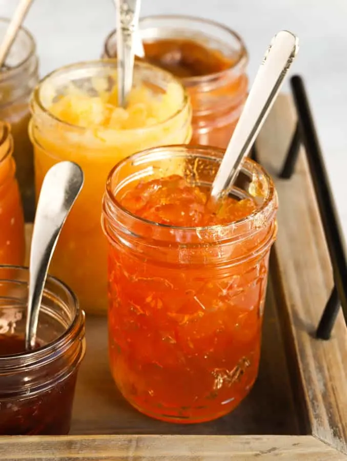 Jars of orange marmalade and other jams made at high altitude