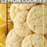 gluten free lemon cookies piled on baking wire rack with lemon slices underneath