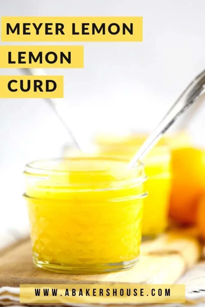 Jars of meyer lemon curd with spoons on wooden cutting board