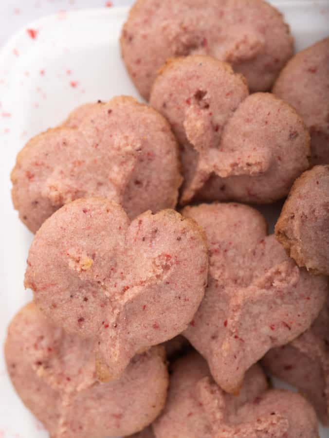 heart shaped spritz cookies on white plate