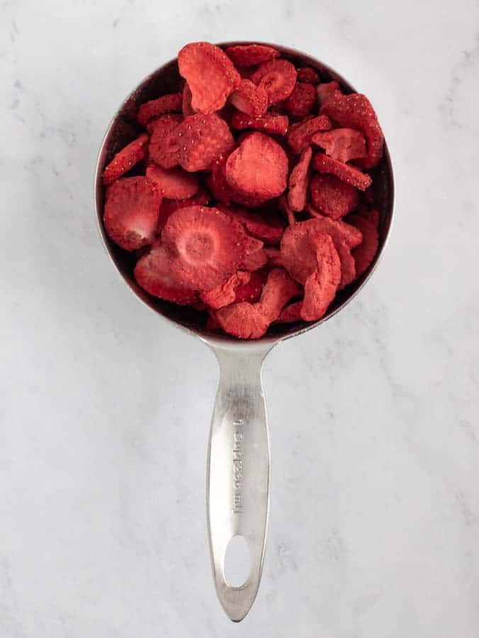 freeze dried strawberries in measuring cup