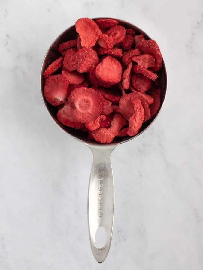 freeze dried strawberries in measuring cup