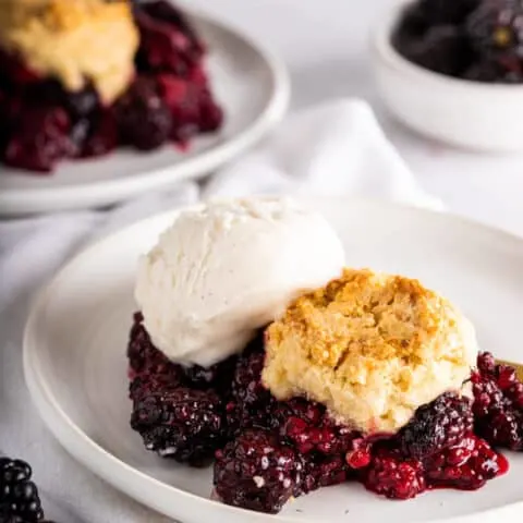 vegan blackberry cobbler on white plate