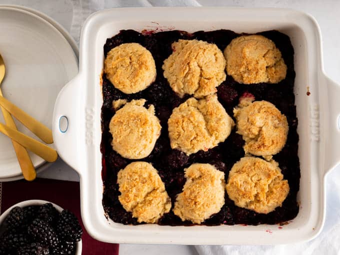 Baked blackberry cobbler in square baking dish