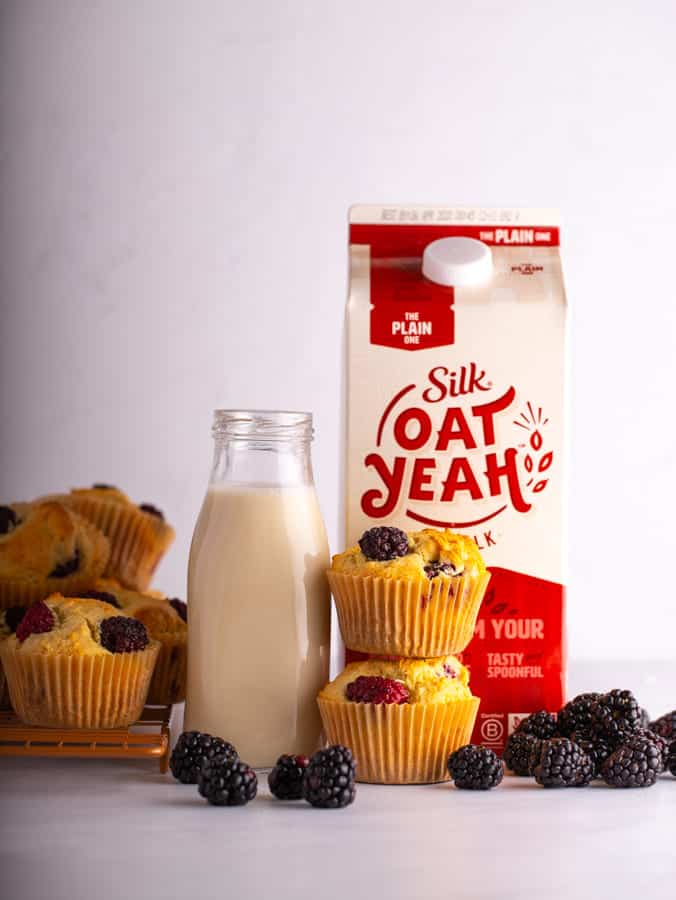 oat yeah oat milk with muffins and blackberries