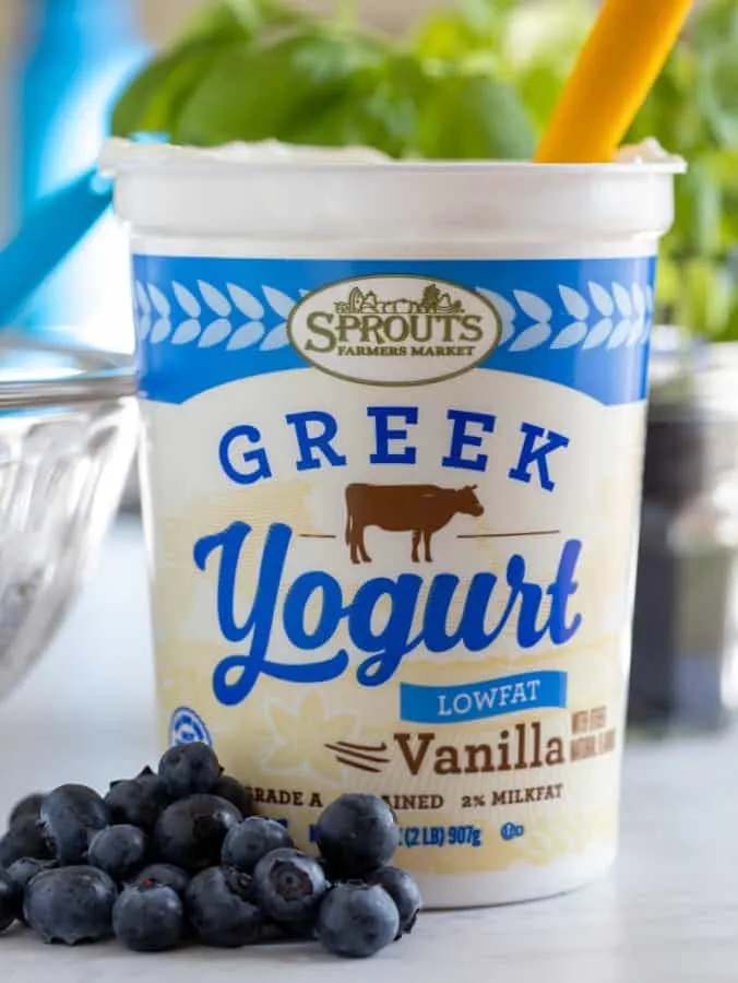 Sprouts Farmers Market container of Vanilla Greek yogurt with fresh blueberries