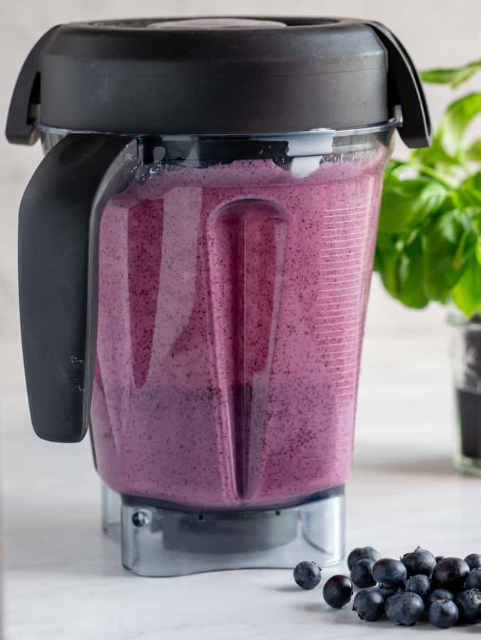 Blueberry and Greek yogurt mixture in a Vitamix blender making popsicles