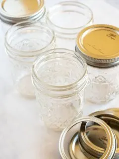 mason jars clean and sterilized on a white surface