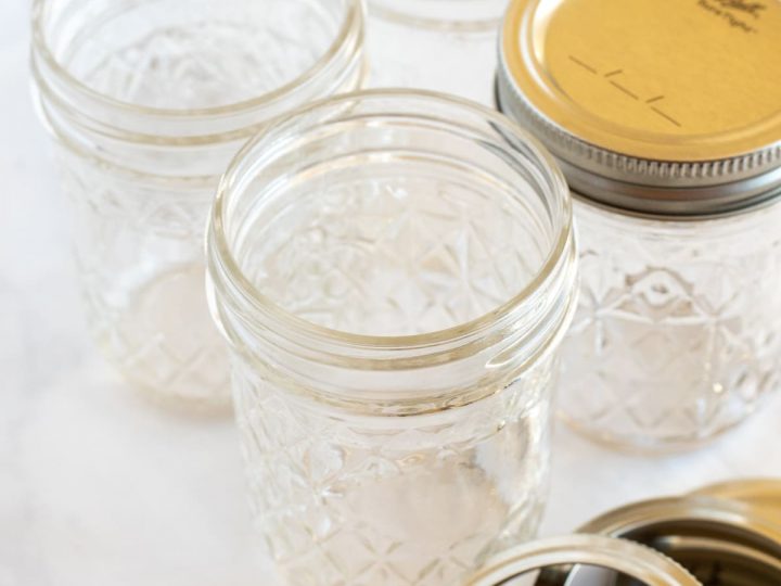 https://www.abakershouse.com/wp-content/uploads/2020/09/Glass-Mason-Jars-and-lids-on-white-surface-720x540.jpg