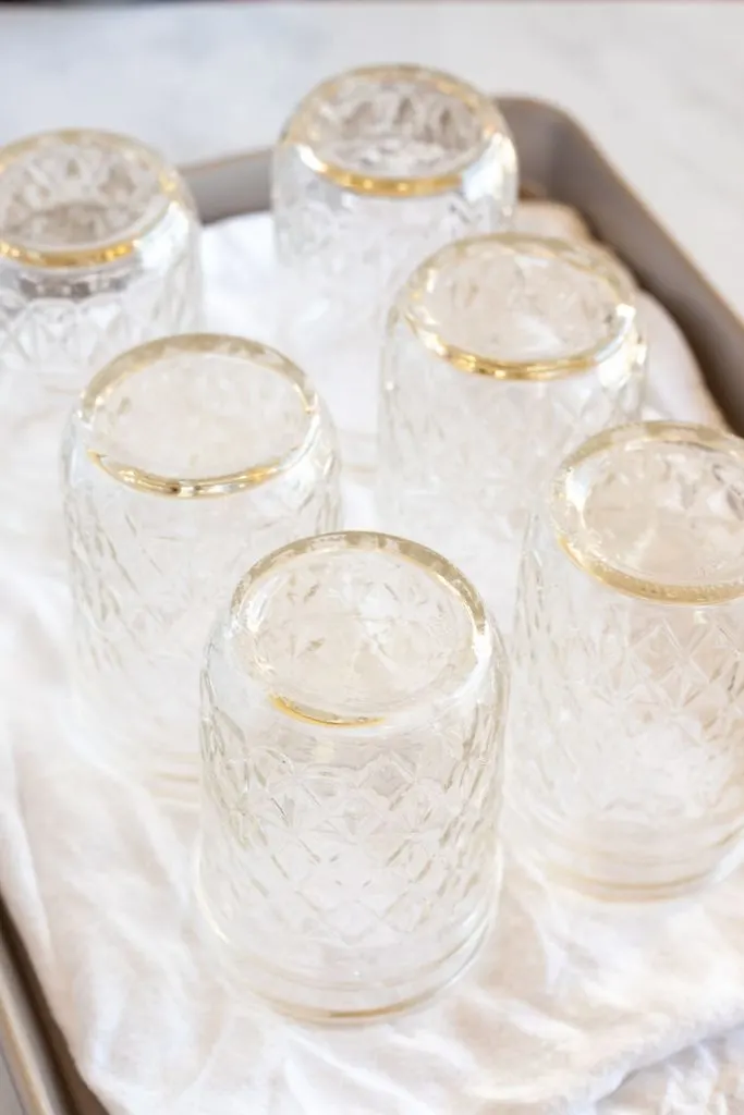 upside down, clean, empty mason jars on a white towel