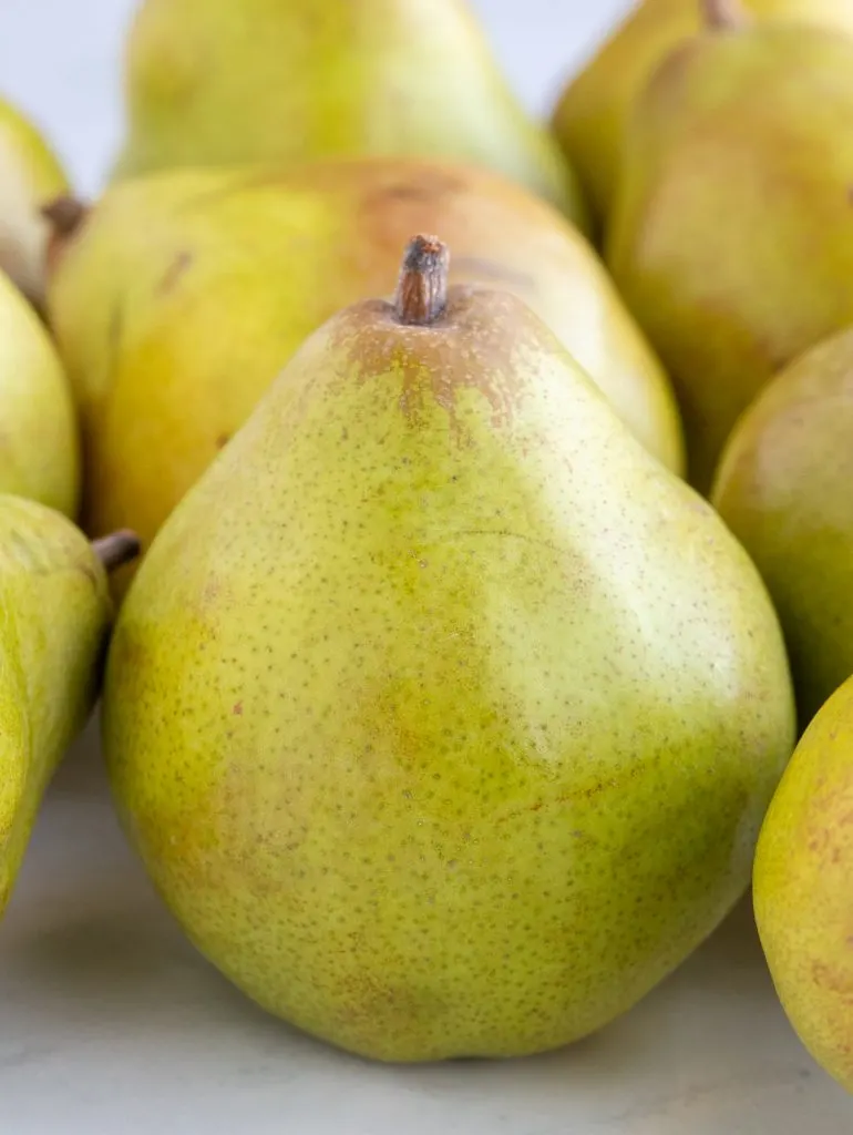 Comice pears close up on a marble surface