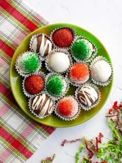 plate of assorted decorated holiday chocolate truffles