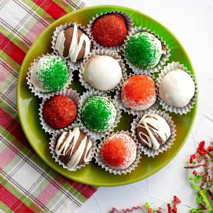 plate of assorted decorated holiday chocolate truffles