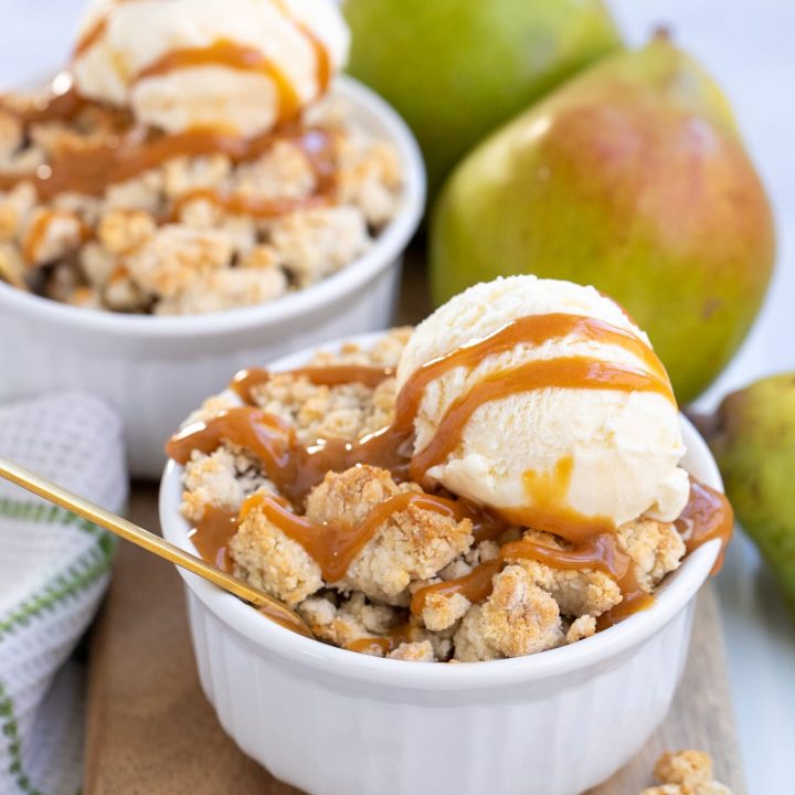 individual pear cobbler with ice cream and caramel sauce on top