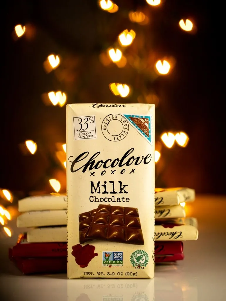 Milk chocolate Chocolove bar with heart shaped bokeh in background