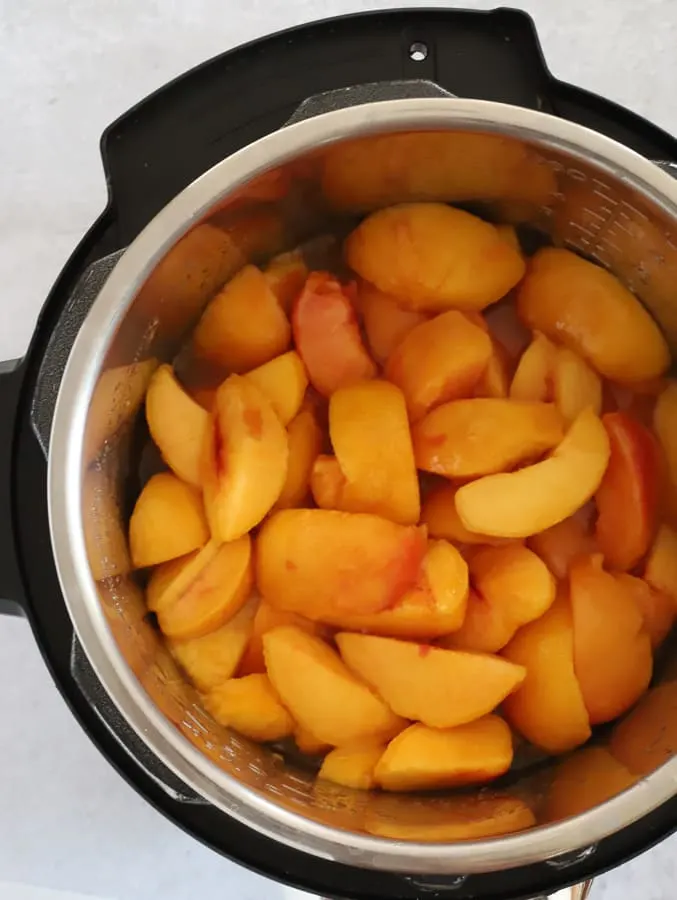 sliced and peeled peaches in an Instant Pot before cooking