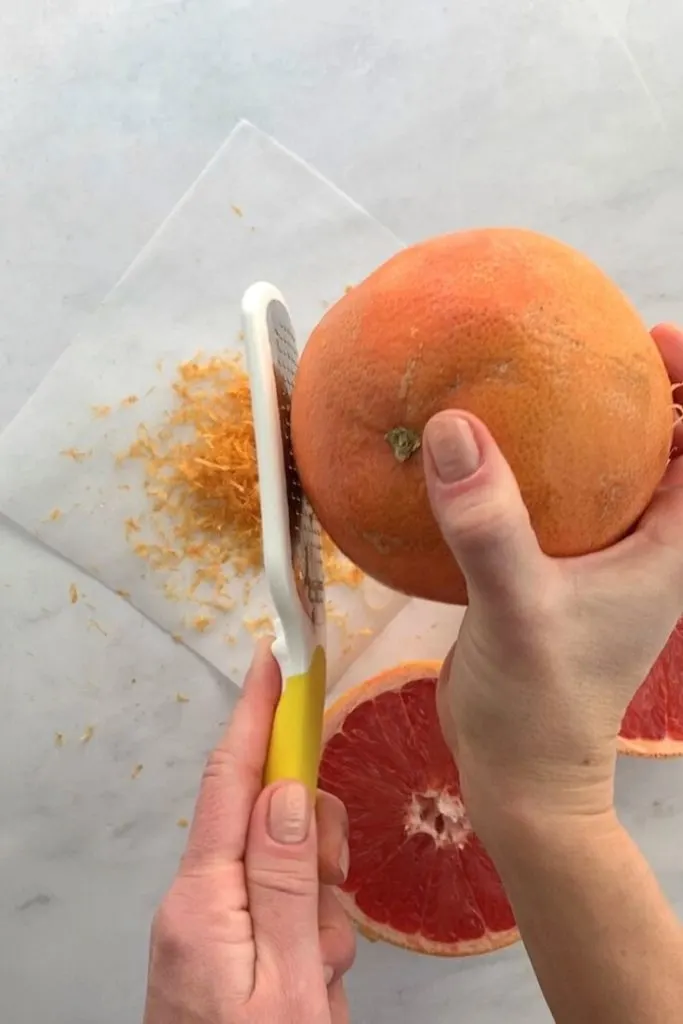 citrus tool takes zest layer off of grapefruit