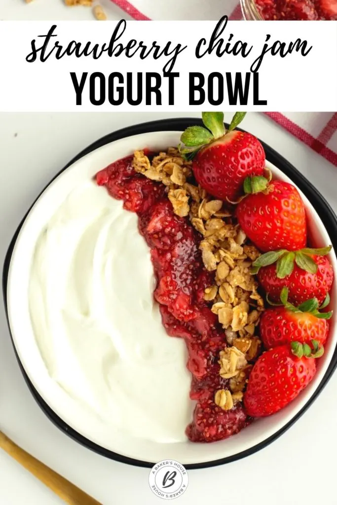 wallaby organic greek yogurt with jam, granola and strawberries in black bowl
