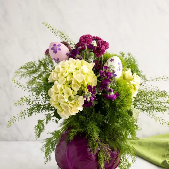 cabbage as a vase for flower arrangement