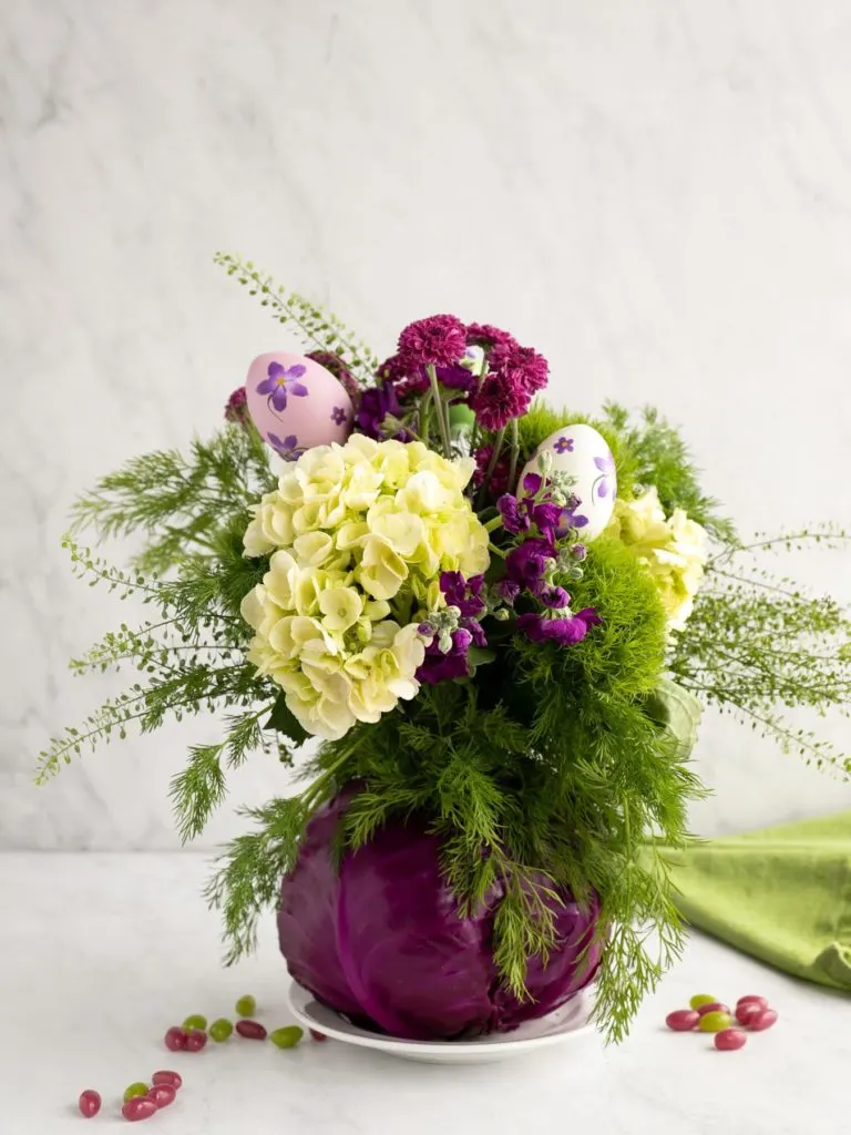 cabbage as a vase for flower arrangement