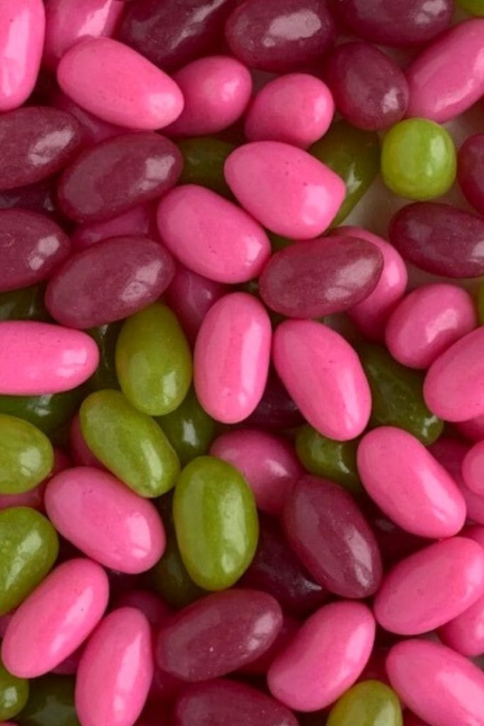pink, green and purple jellybeans close up