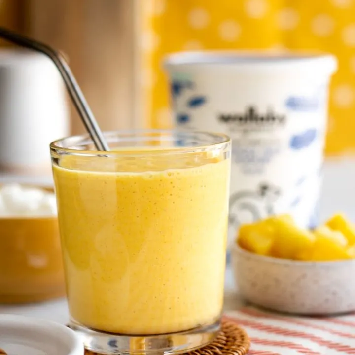 yellow smoothie made with pineapple, mango and turmeric and wallaby Greek yogurt