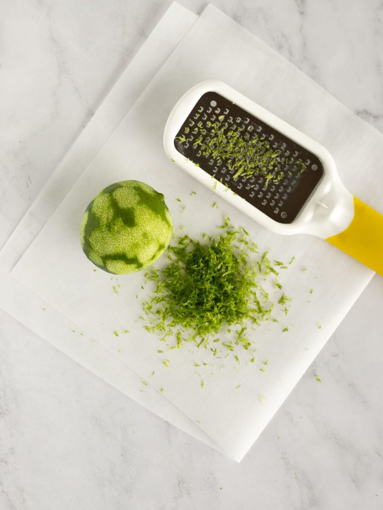 lime zest, lime and citrus zest tool on parchment