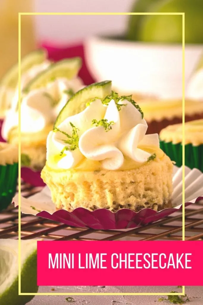 close up photo of bite sized lime cheesecake with whipped cream and lime slice