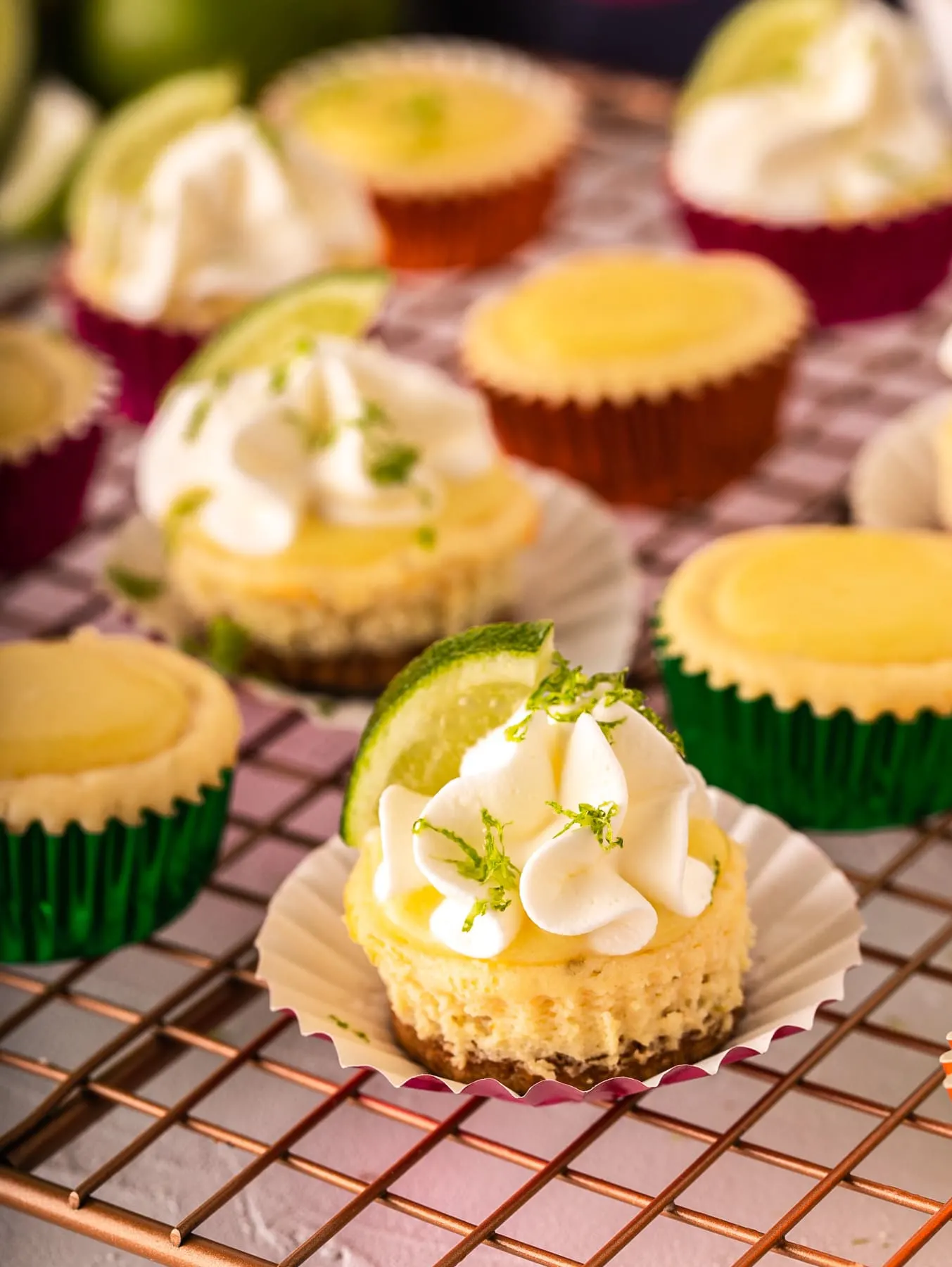 mini baked cheesecakes with whipped cream and lime curd