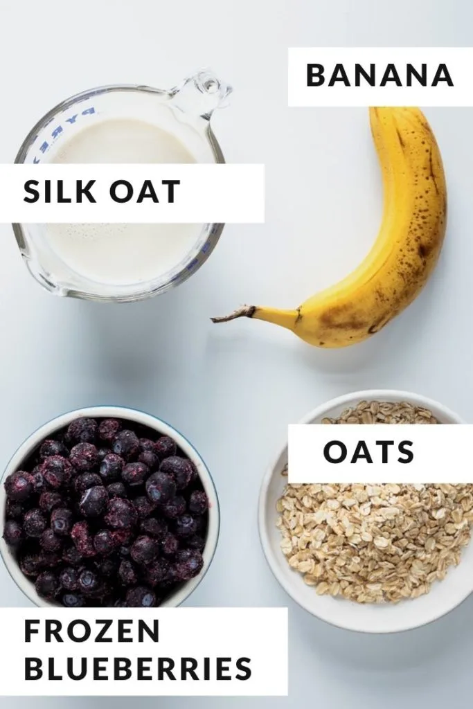 ingredients for smoothie of blueberry, banana, oatmilk and oats