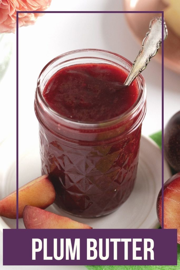 mason jar with plum butter on white plate