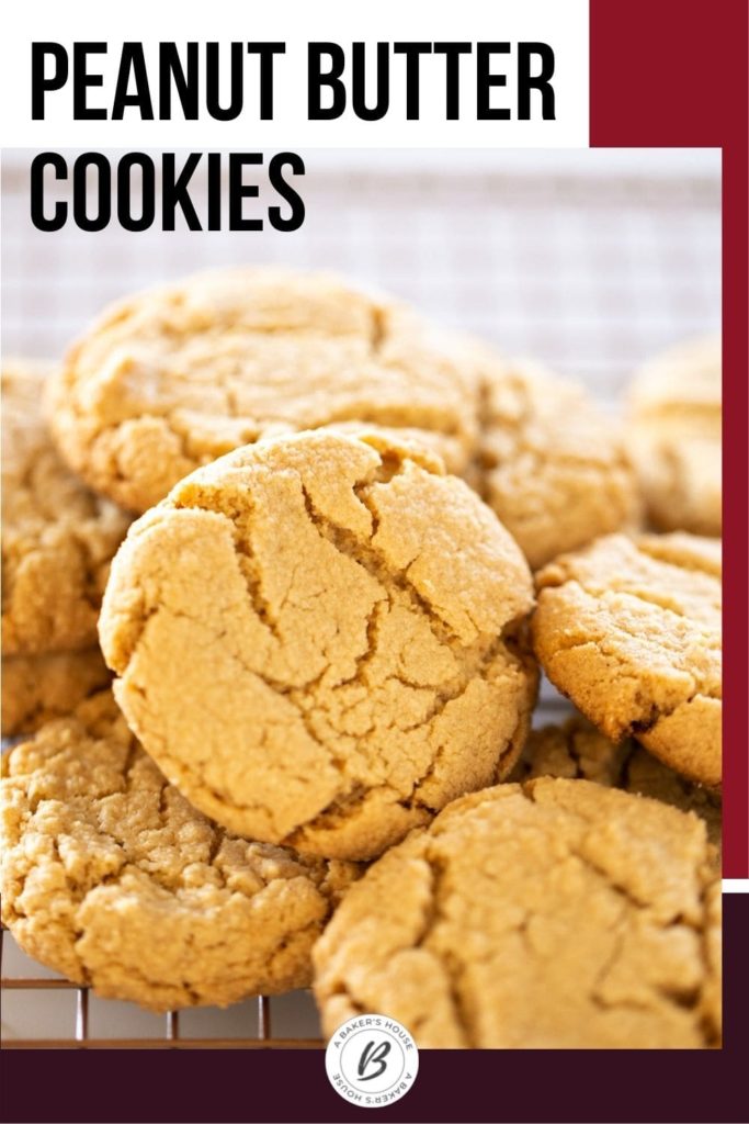 group of peanut butter cookies in a pile on cookie rack